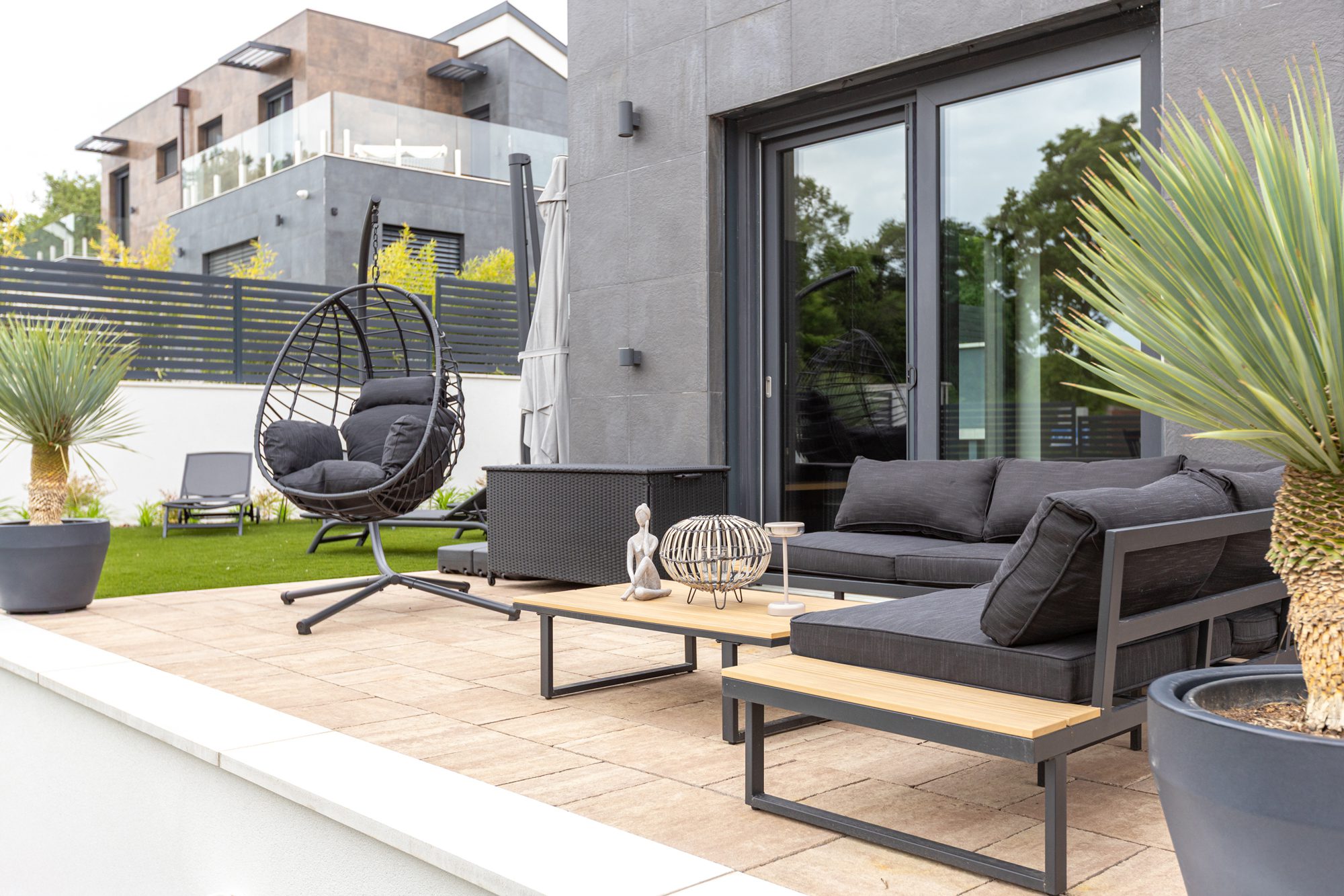 Villa Porta Verde II modern patio with dark grey furniture and garden